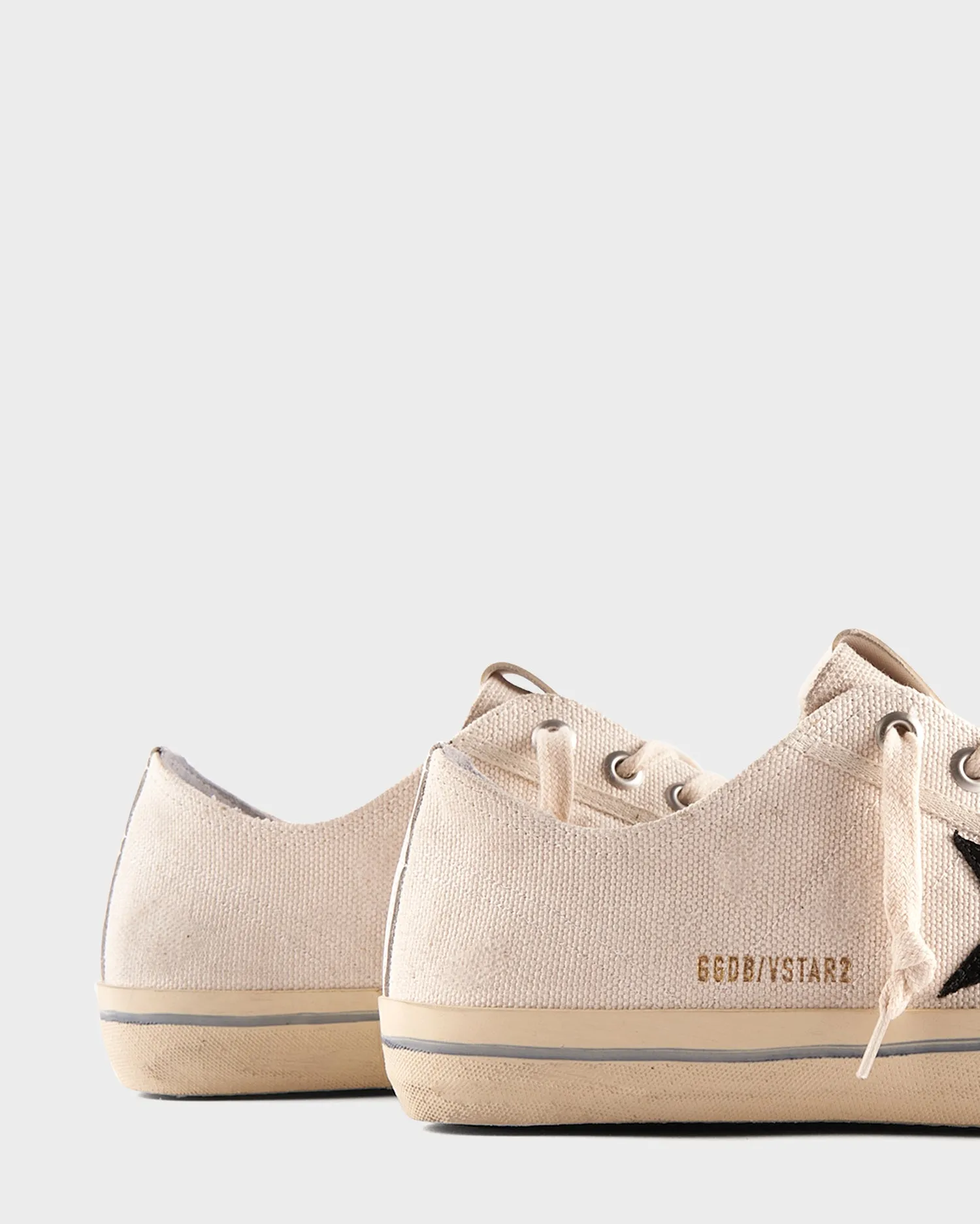 Off White Canvas And Black Star Sneakers